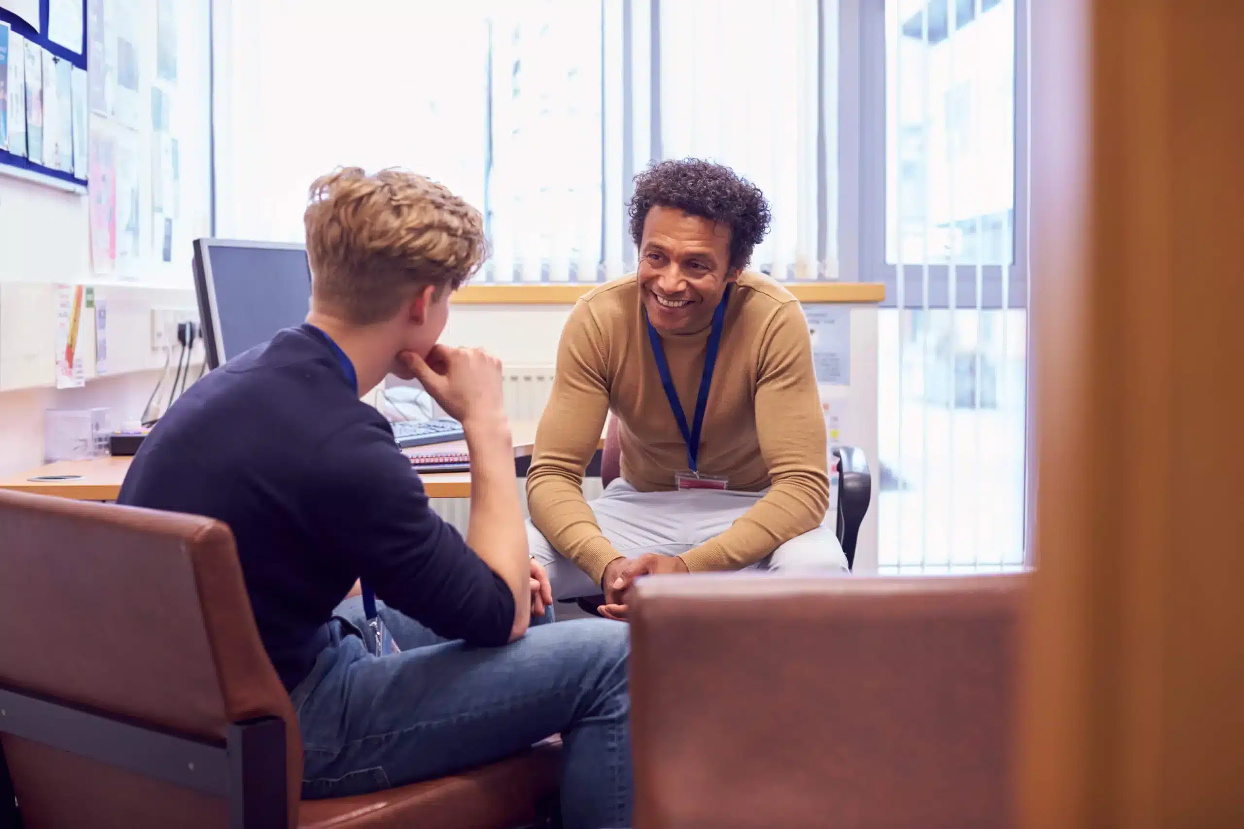 Student talking with teacher